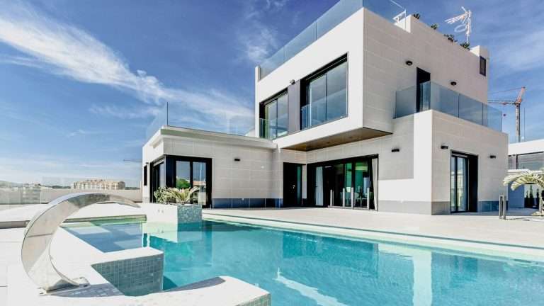 Modern Florida-style home exterior with pool